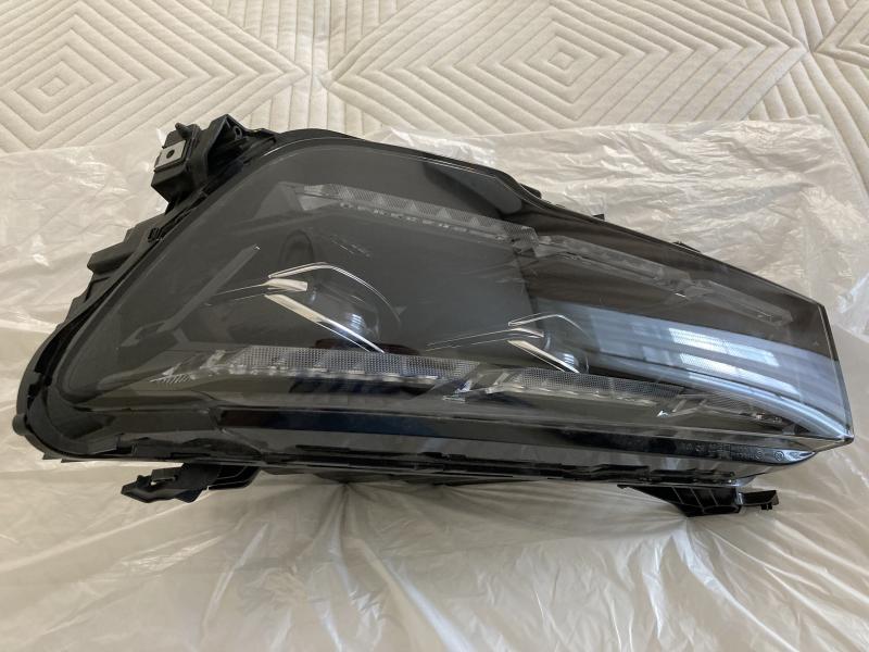 фара левая Geely Monjaro 7051047300